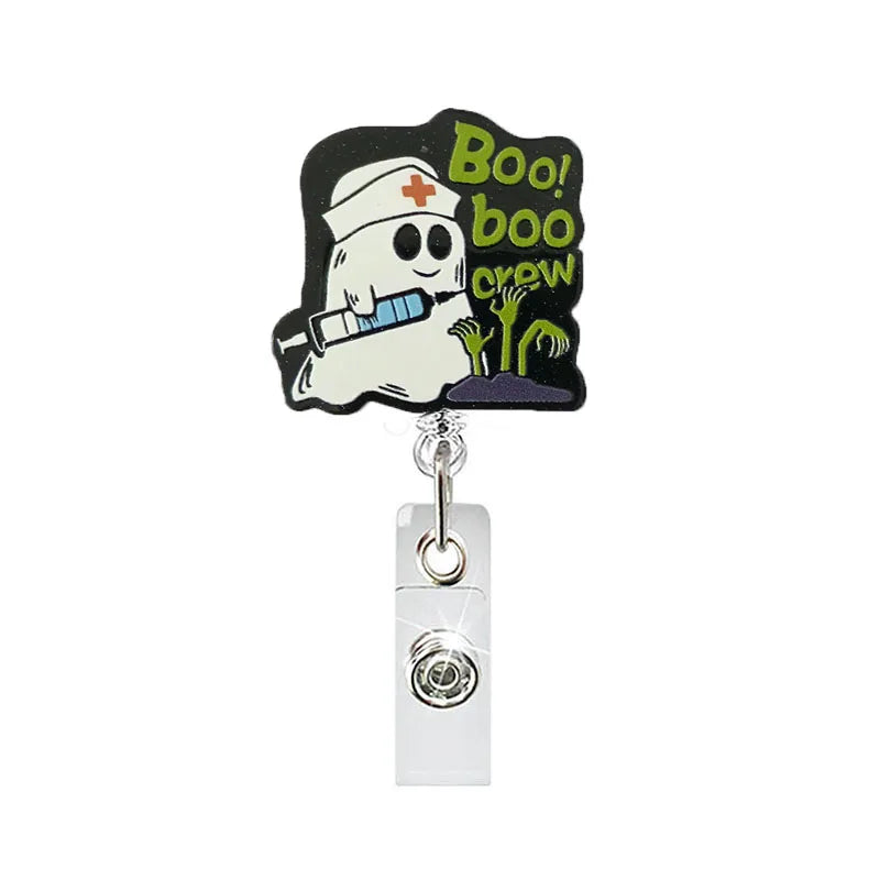 badge reel "boo boo crew". Retractable with alligator clip.