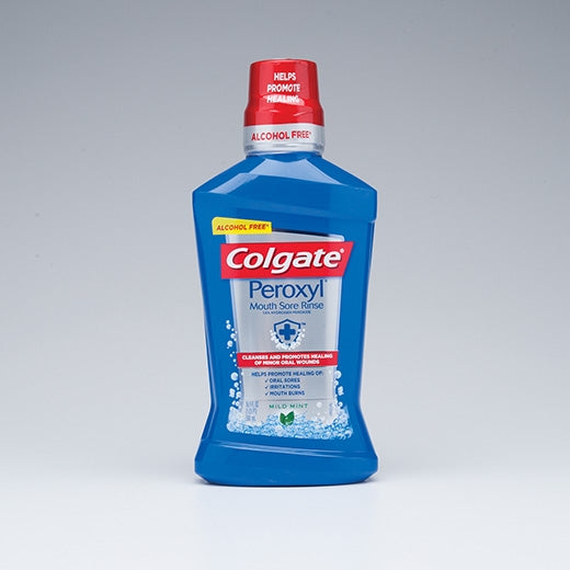 A bottle of colgate peroxyl mouth sore rinse. blue liquid. alcohol free.