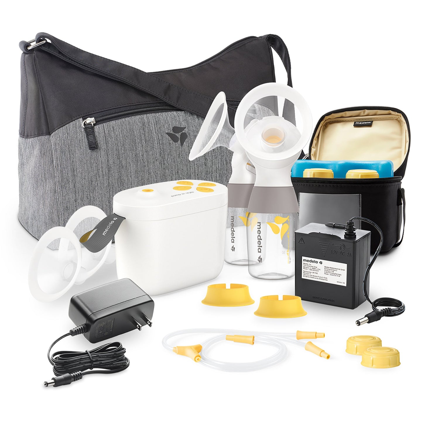 Breast pump with milk collection bottles, flanges, lid, charger, microfiber bag.