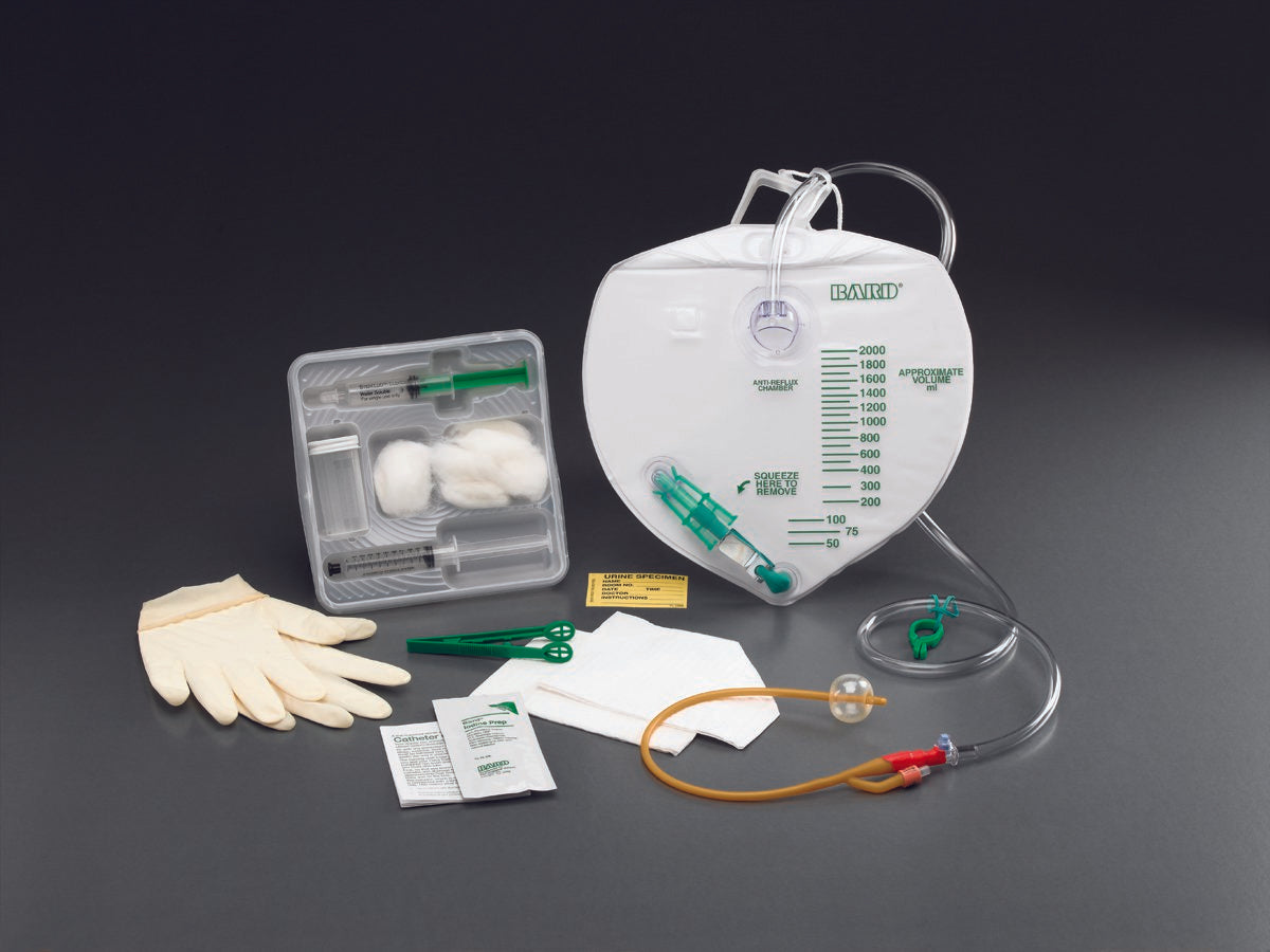 Catheter tray with gloves, foley, drainage bag, iodine, prefilled syringe, tray, urine specimen cup, and sheet cover