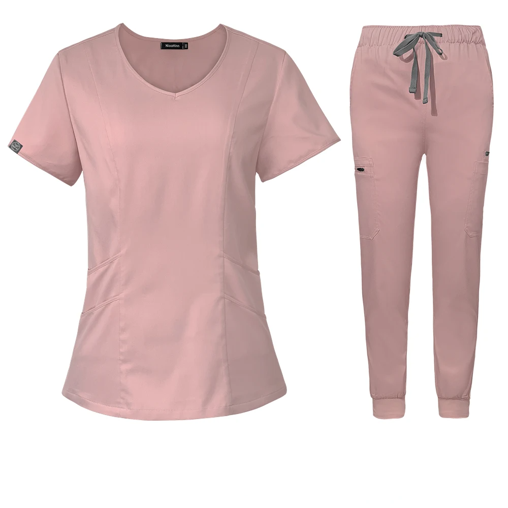 pink scrub set scoop neck style with jogger-style pants with elastic waistband and adjustable drawstrings