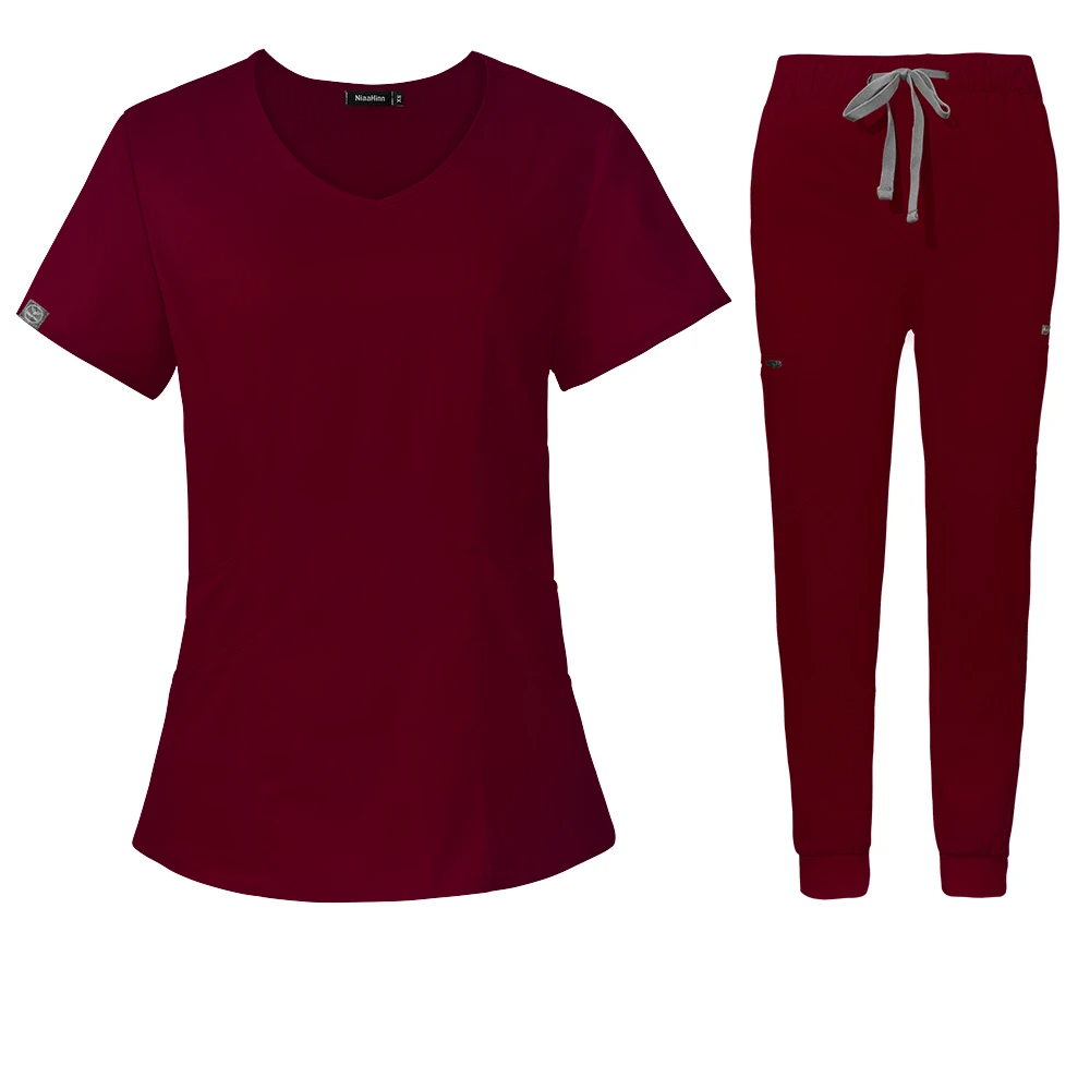 burgundy scrub set scoop neck style with jogger-style pants with elastic waistband and adjustable drawstrings