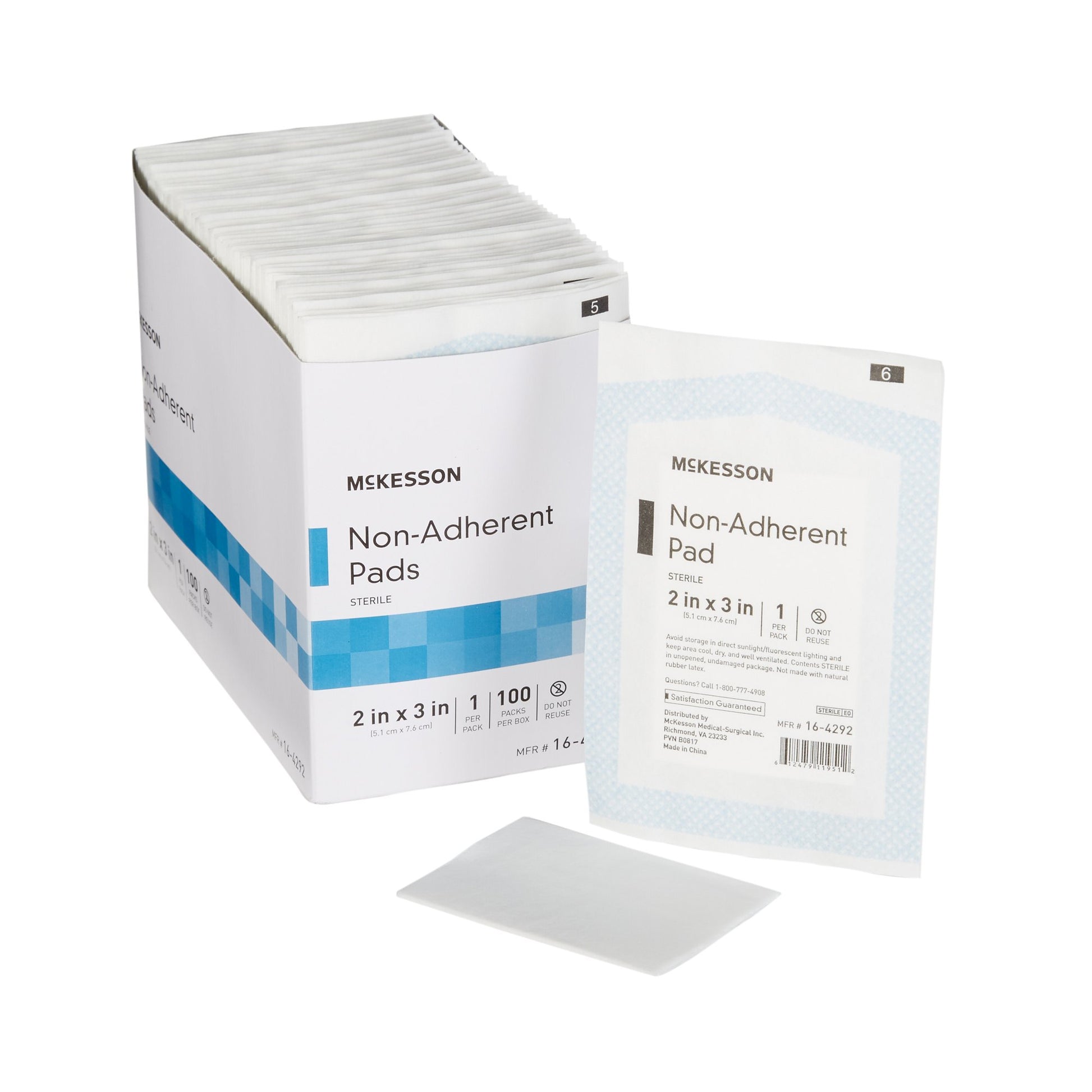 a box of mckesson non-adherent pads, 2 inch x 3 inch, white pad.