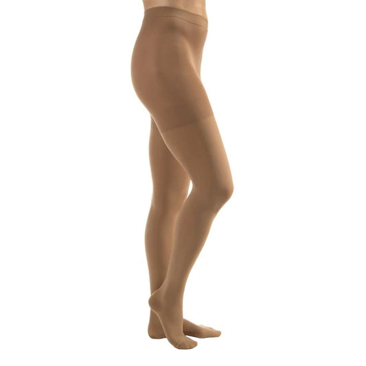 Model wearing waist high, beige compression stockings