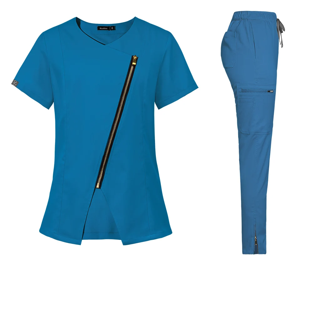 blue stylish scrub set. Scrub top with zipper going across the chest. Scrub pant with zippers on ankle cuffs, elastic waistband, adjustable drawstrings