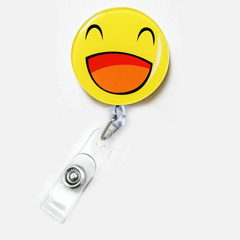 badge reel smiley face with mouth opening emoji. Retractable