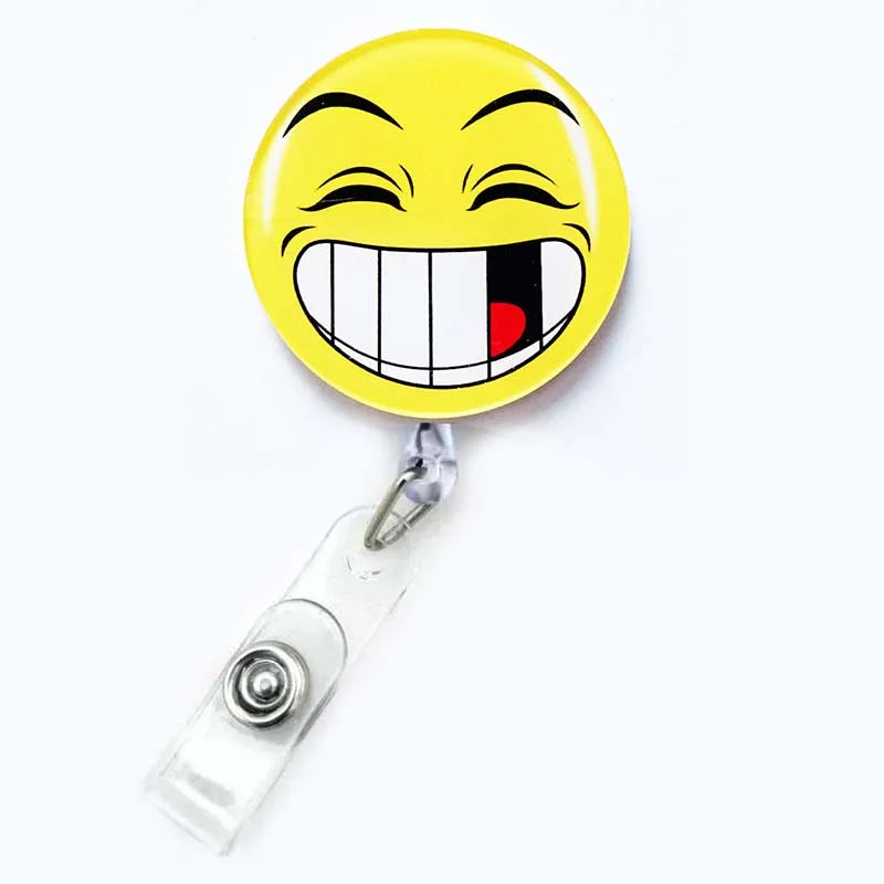 badge reel smiley face with a missing tooth emoji. Retractable