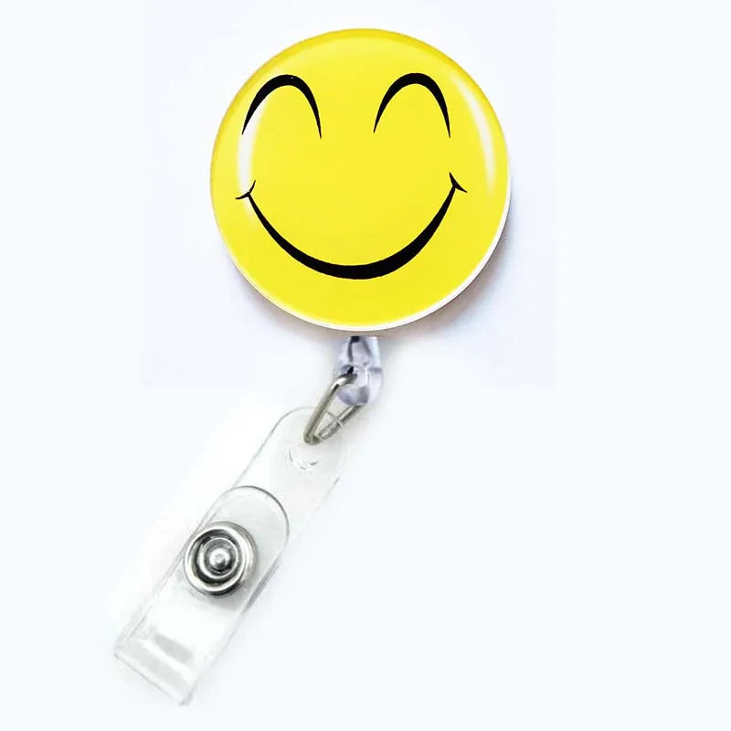 badge reel smiley face with eyes closed emoji. Retractable