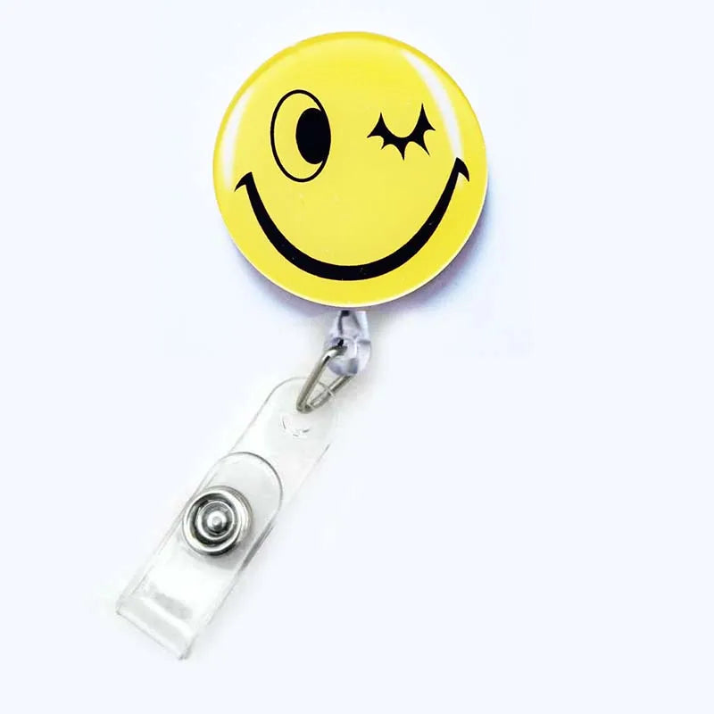 badge reel winky face emoji. Retractable