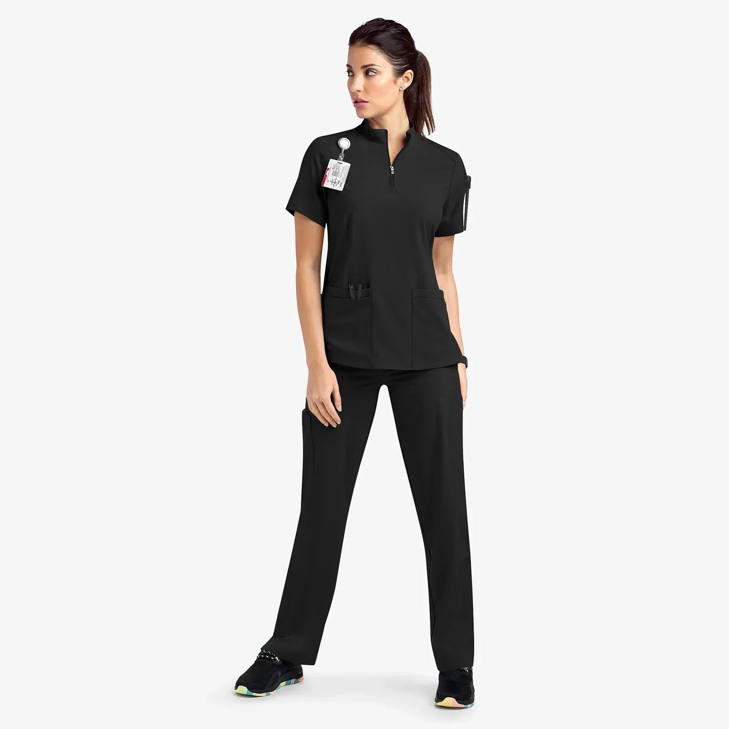 black scrub set. scrub top with zippered neckline, multiple pockets.