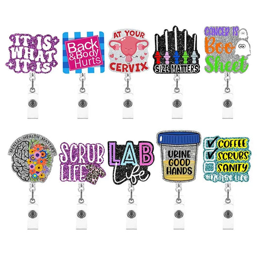 A variety of badge reels - "it is what it is", "back & body hurts", "at your cervix", "size matters", "cancer is boo sheet", "mental health matters", "scrub life", "lab life", "urine good hands", "coffee scrubs sanity #nurselife"