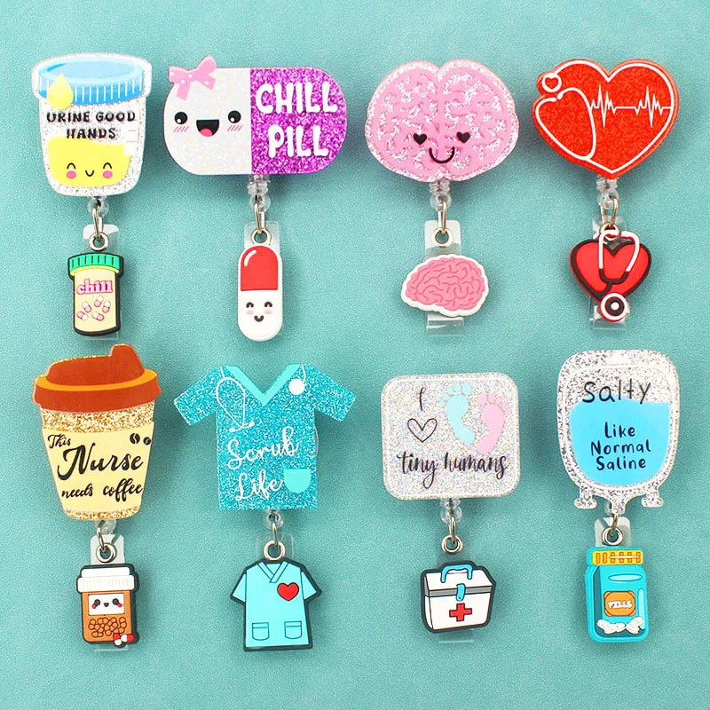 Different badge reel designs - urine good hands, chill pill, brain, heart, EKG, the nurse needs coffee, scrub life, i love tiny humans, salty like normal saline