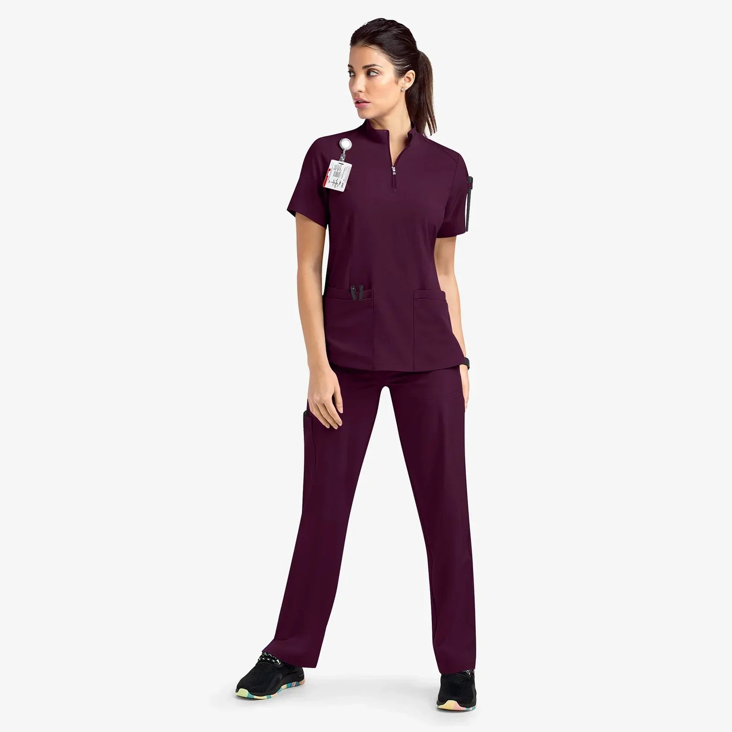 deep burgundy scrub set. scrub top with zippered neckline, multiple pockets.