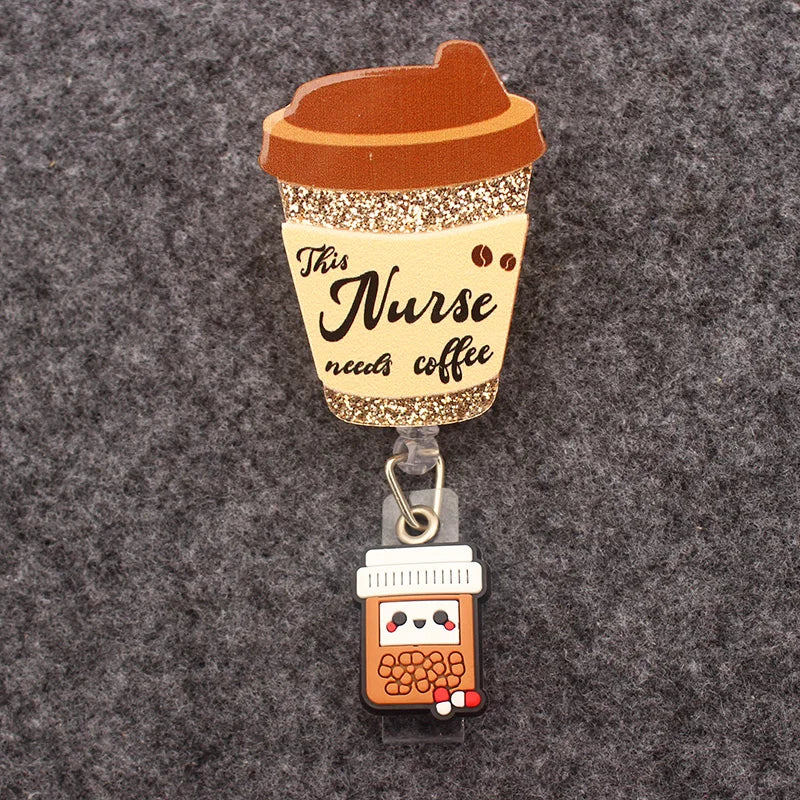 badge reel "the nurse needs coffee" coffee cup with a bottle of pill on top of the ID holder clasp