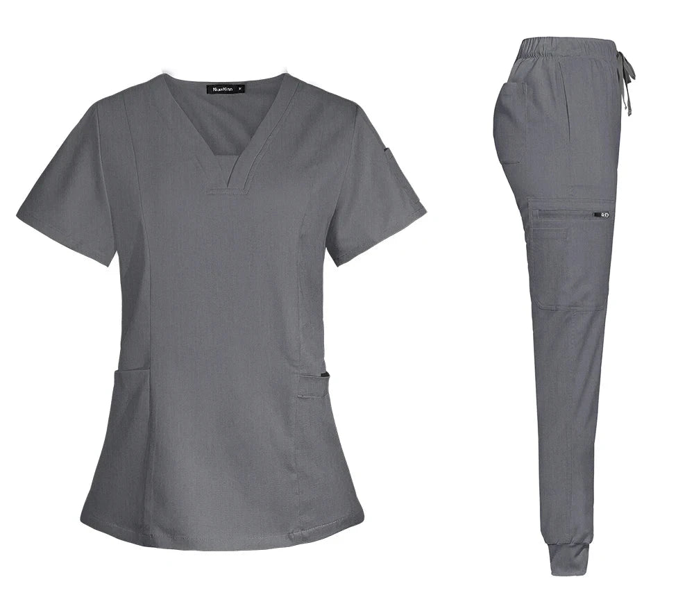 gray/silver women scrub set with v-neck top with pockets, jogger-style pants with back, front and side pockets