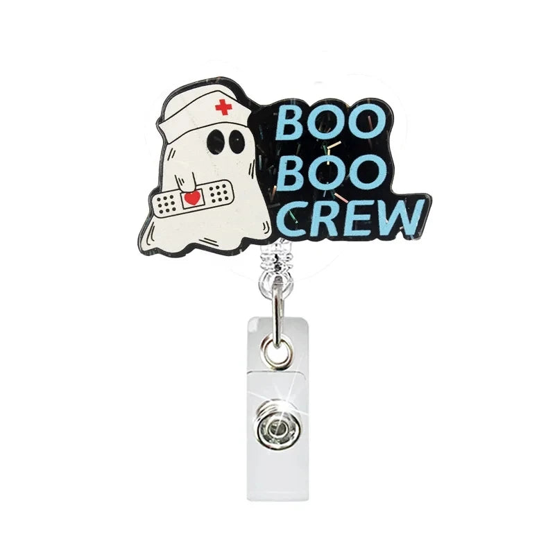 badge reel "boo boo crew". Retractable  with alligator clip.