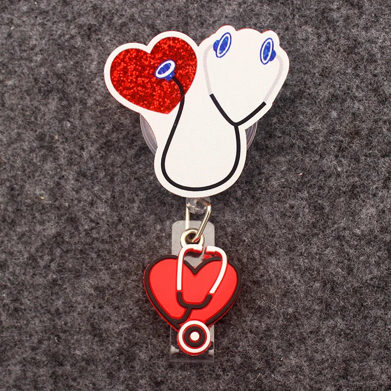 badge reel with stethoscope listening to a heart. Under ID holder clasp, a heart with stethoscope.