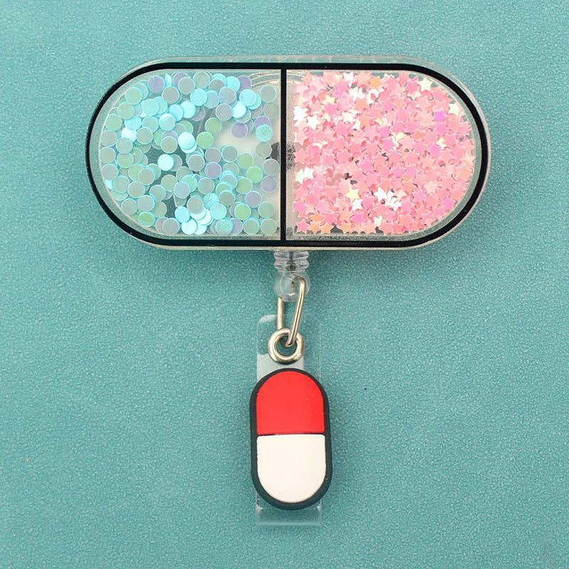 badge reel - glittery pill with another smaller pill on the ID badge clasp