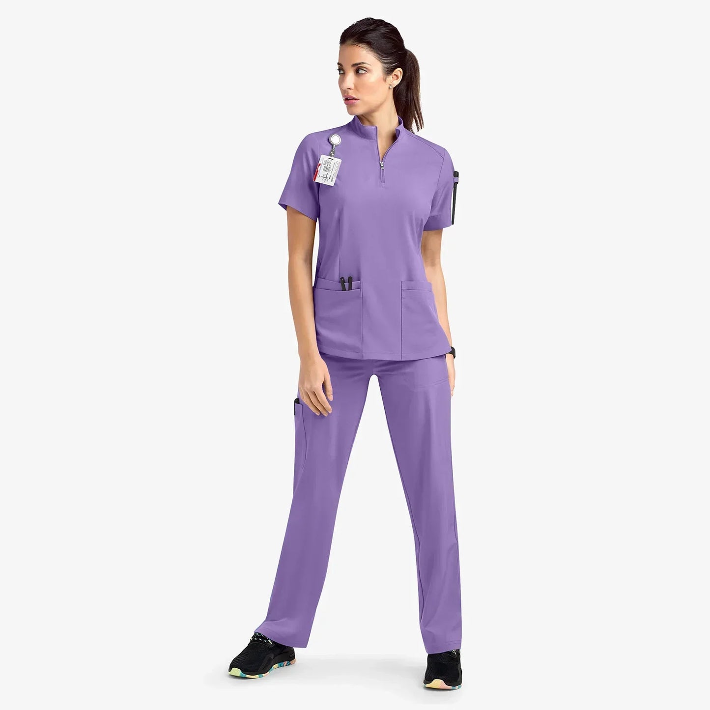 light purple scrub set. scrub top with zippered neckline, multiple pockets.