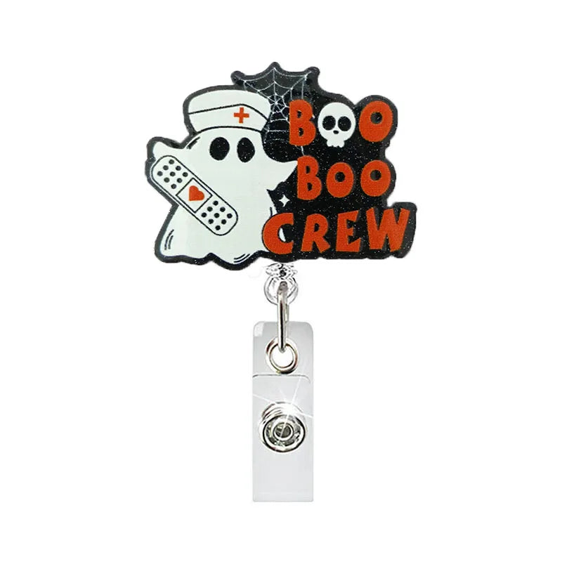 badge reel "boo boo crew". Retractable  with alligator clip.