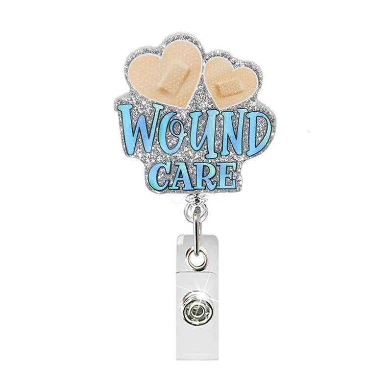 badge reel - hearts with bandaids "WOUND CARE". Retractable, alligator clip.