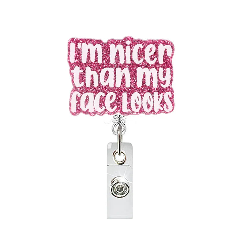 badge reel "i'm nicer than my face looks". Retractable, alligator clip.