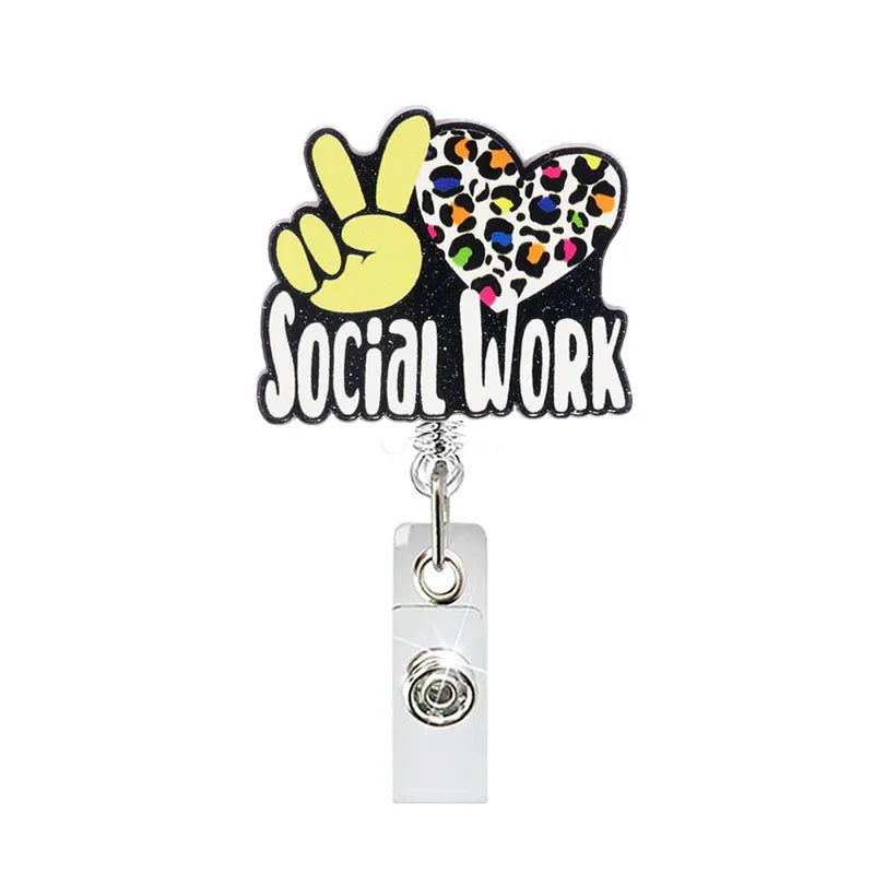 badge reel "SOCIAL WORK" with peace sign. Retractable, alligator clip.