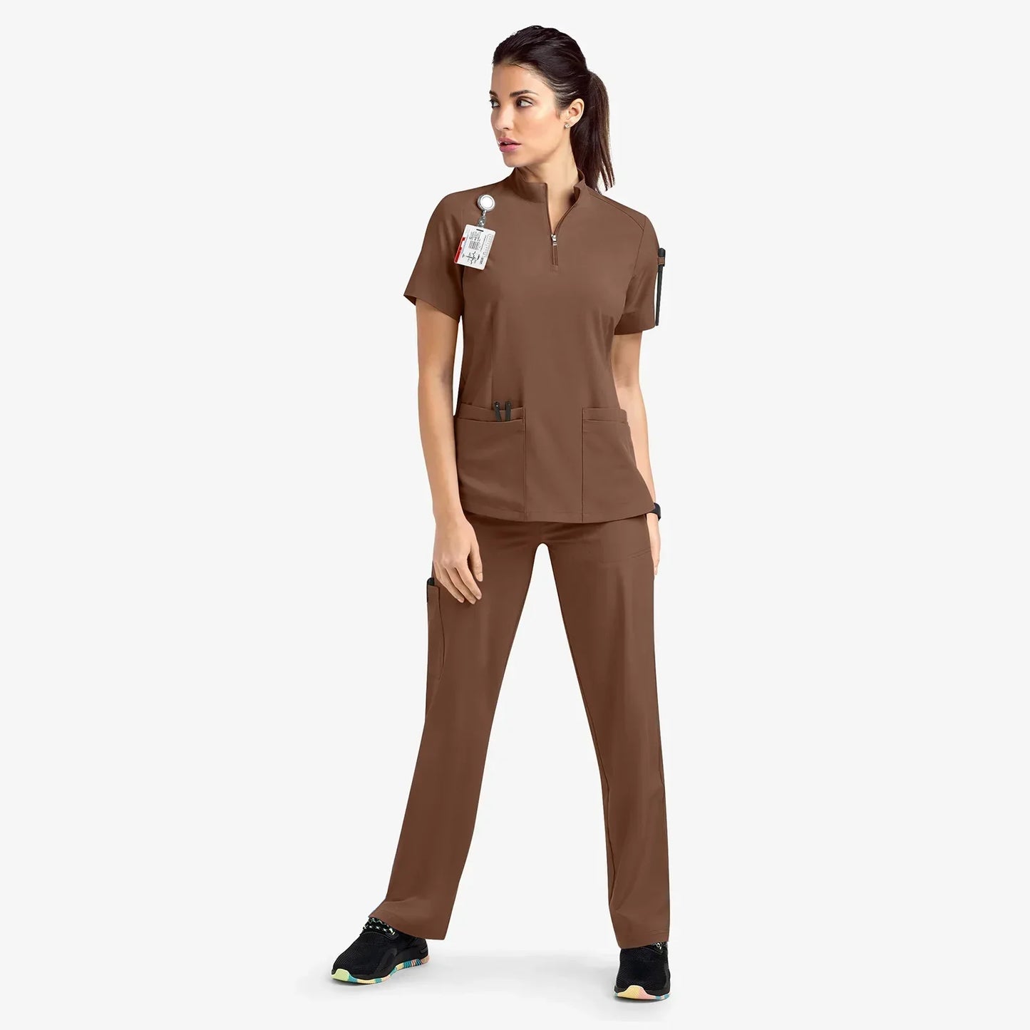 brown scrub set. scrub top with zippered neckline, multiple pockets.