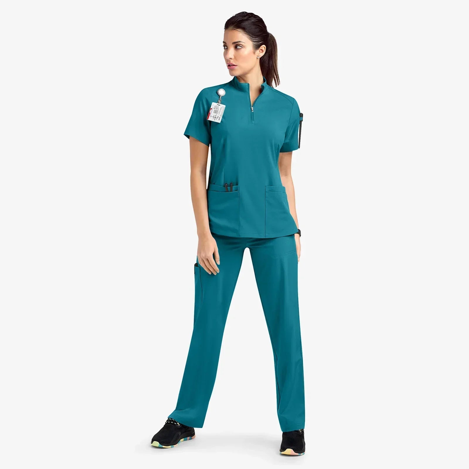 teal scrub set. scrub top with zippered neckline, multiple pockets.