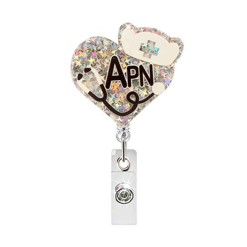 badge reel "APN" with heart, nurse's hat and a stethoscope. Retractable, alligator clip.