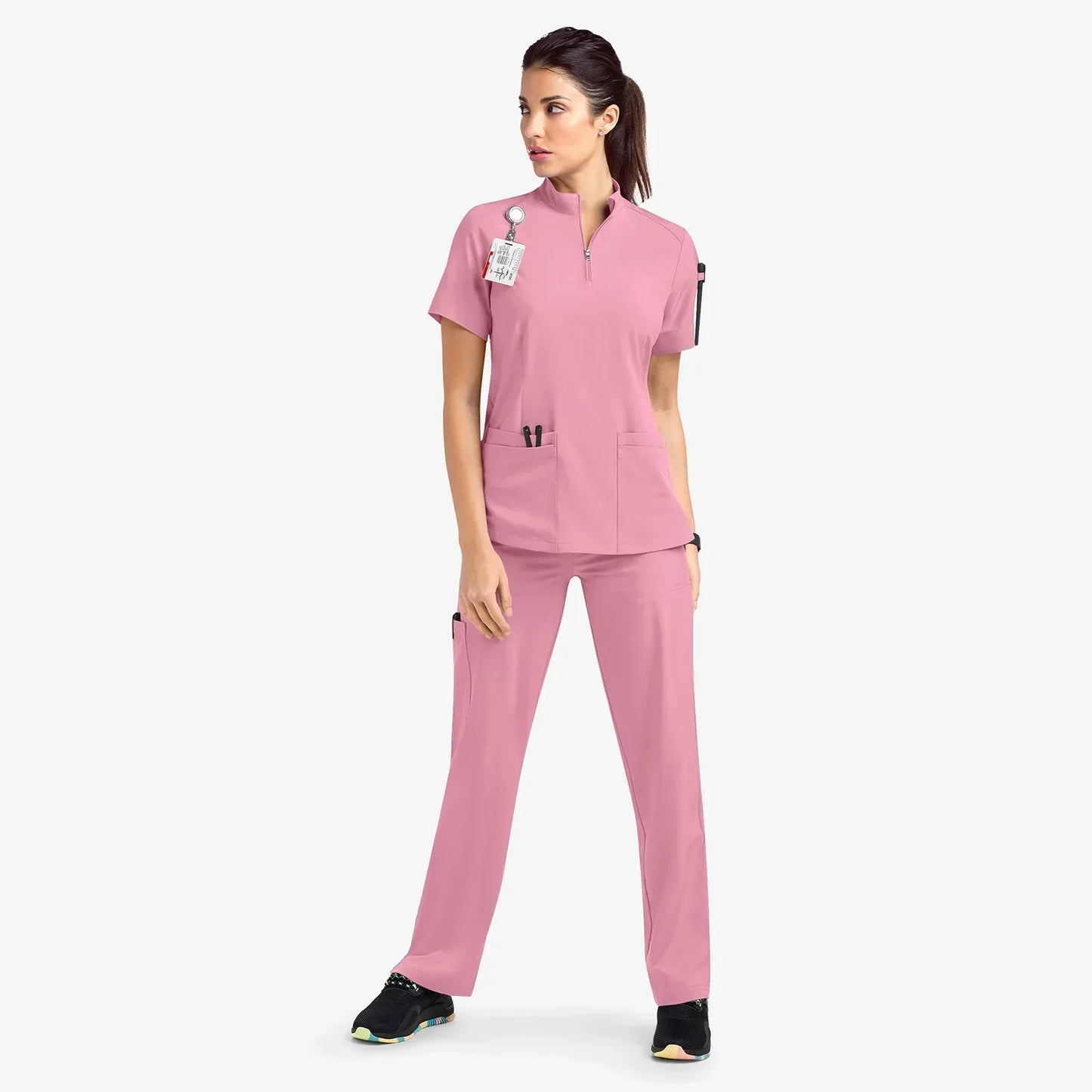 pink scrub set. scrub top with zippered neckline, multiple pockets.