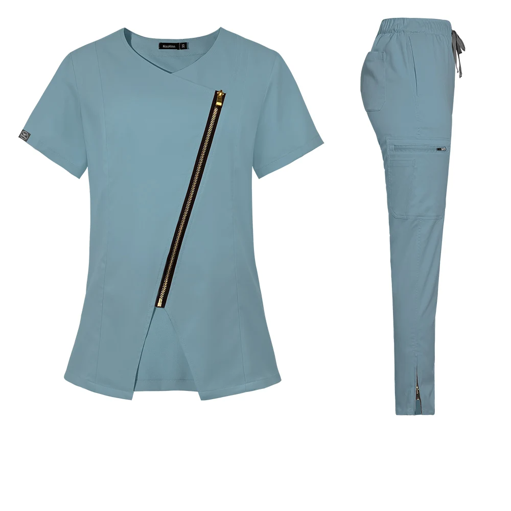 sky blue stylish scrub set. Scrub top with zipper going across the chest. Scrub pant with zippers on ankle cuffs, elastic waistband, adjustable drawstrings