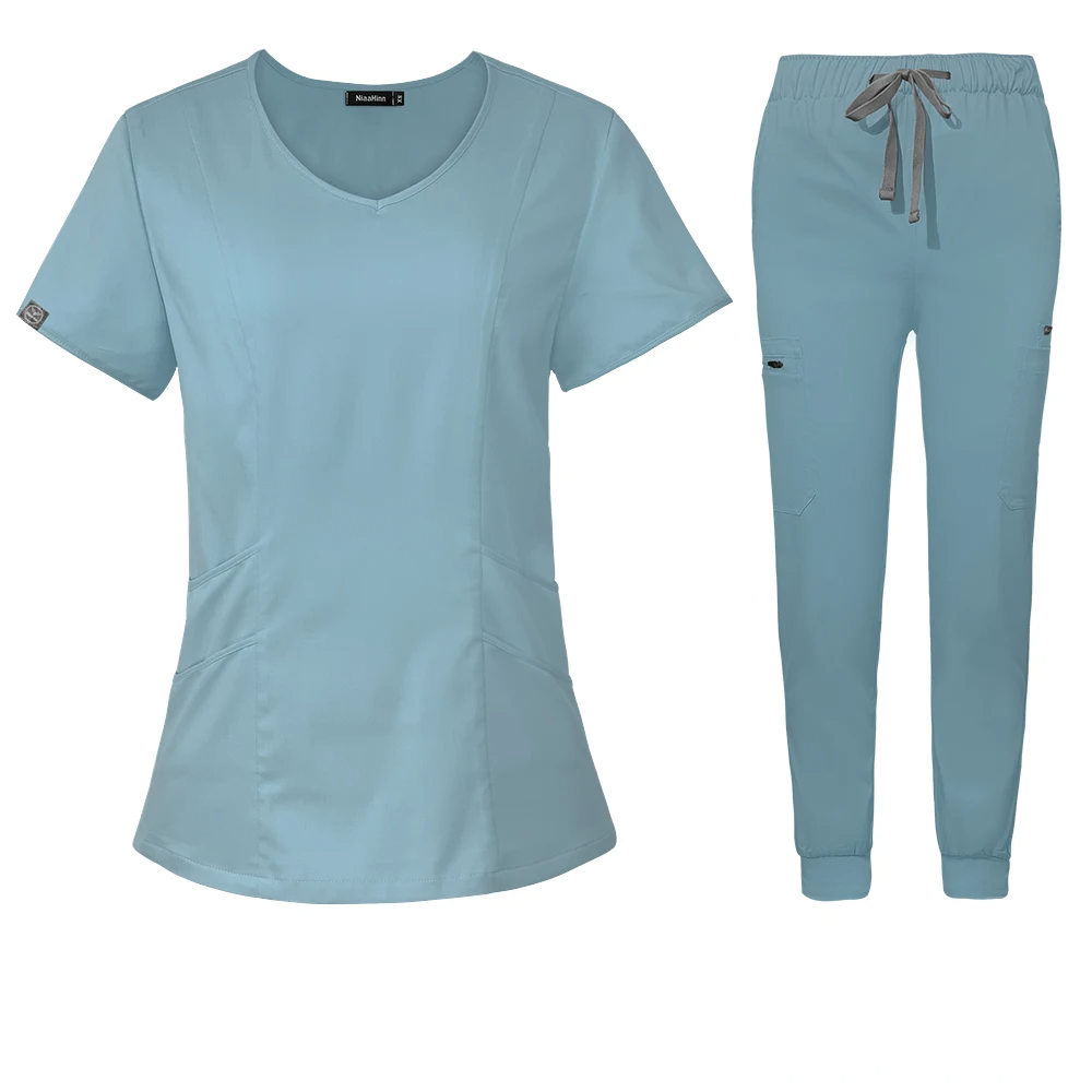 light blue scrub set scoop neck style with jogger-style pants with elastic waistband and adjustable drawstrings